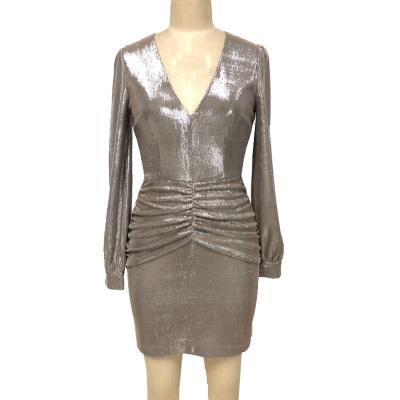 Women's metallic dress with gathered hip.